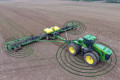 Tractor with sensors in field